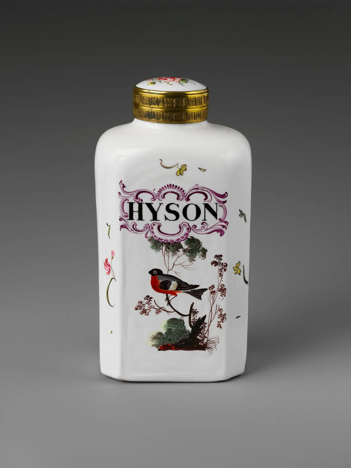 Opaque white glass tea caddy with a gilt metal collar and stopper, enamelled with a small bird on a flowering branch and a red cartouche lettered HYSON
