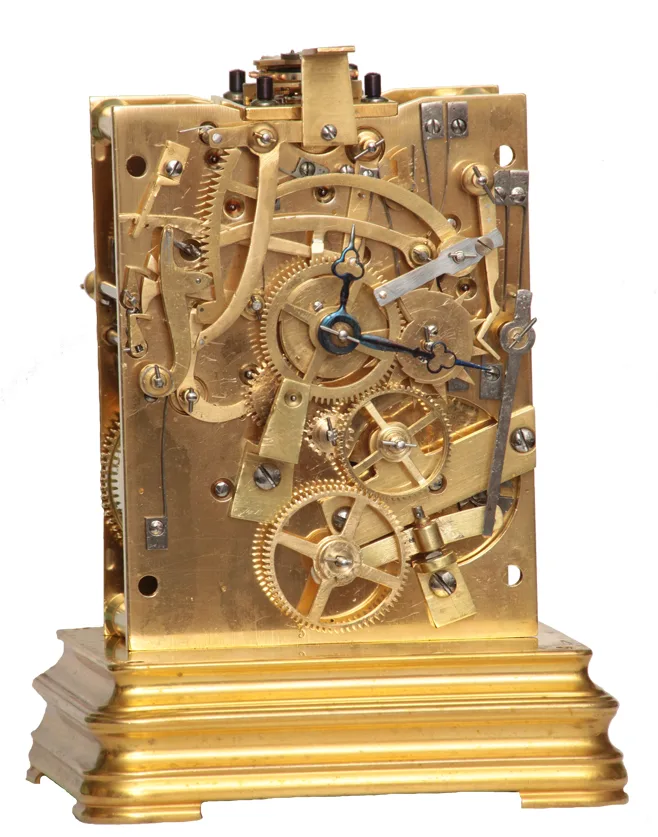 Carriage clock movement with the dial removed, showing the strike work on the front plate: wheels, racks, levers and blued springs