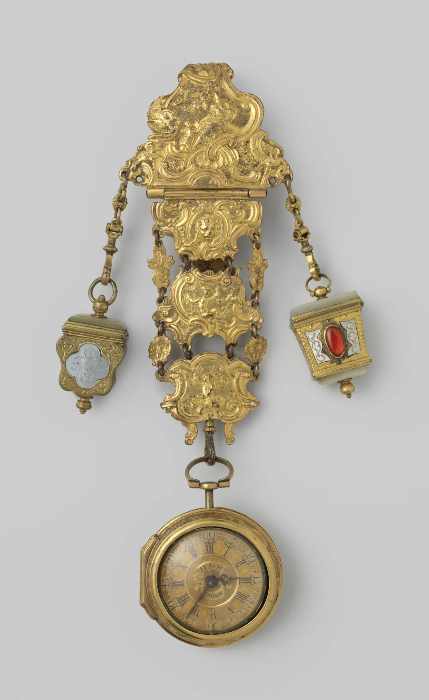 Gilt copper chatelaine of four chased plates carrying a pocket watch and two small mother-of-pearl mounted boxes