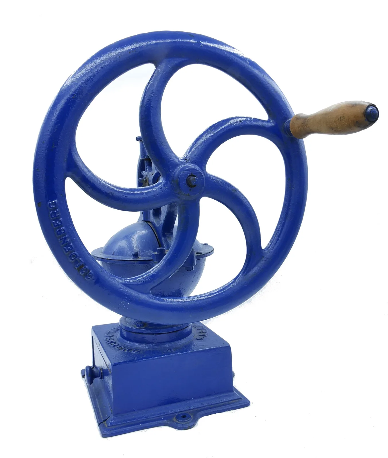Angled view of the same blue commercial mill showing the flywheel and, at the hub and base, cast lettering almost completely filled and obscured by thick blue paint