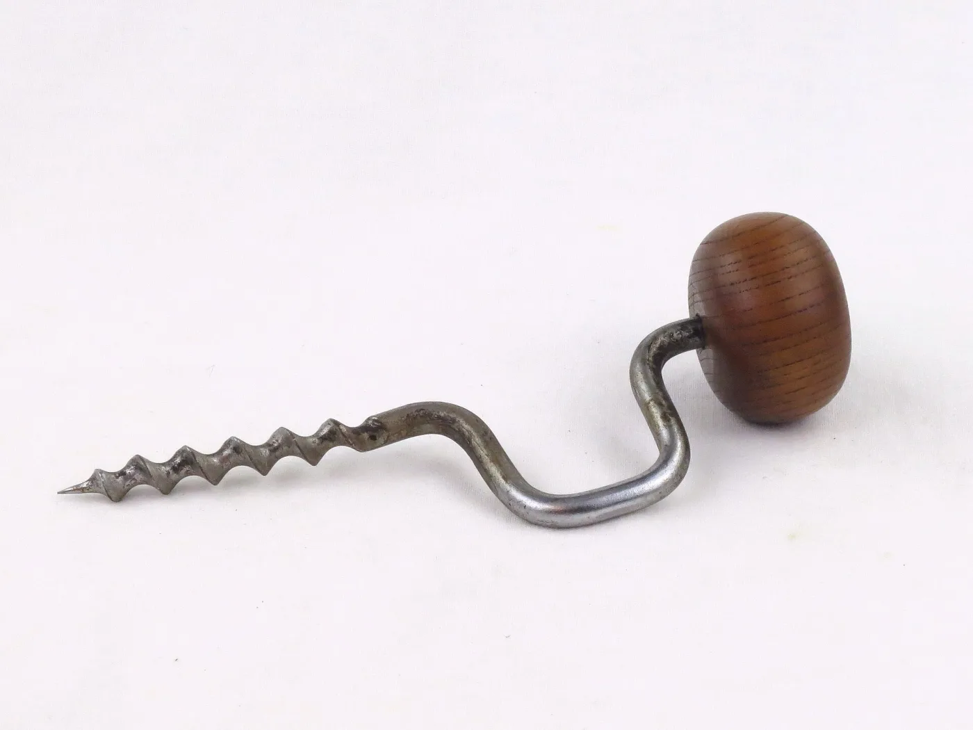Corkscrew with a twisted steel worm on a shank that bends twice into a crank, ending in an egg-shaped wooden handle