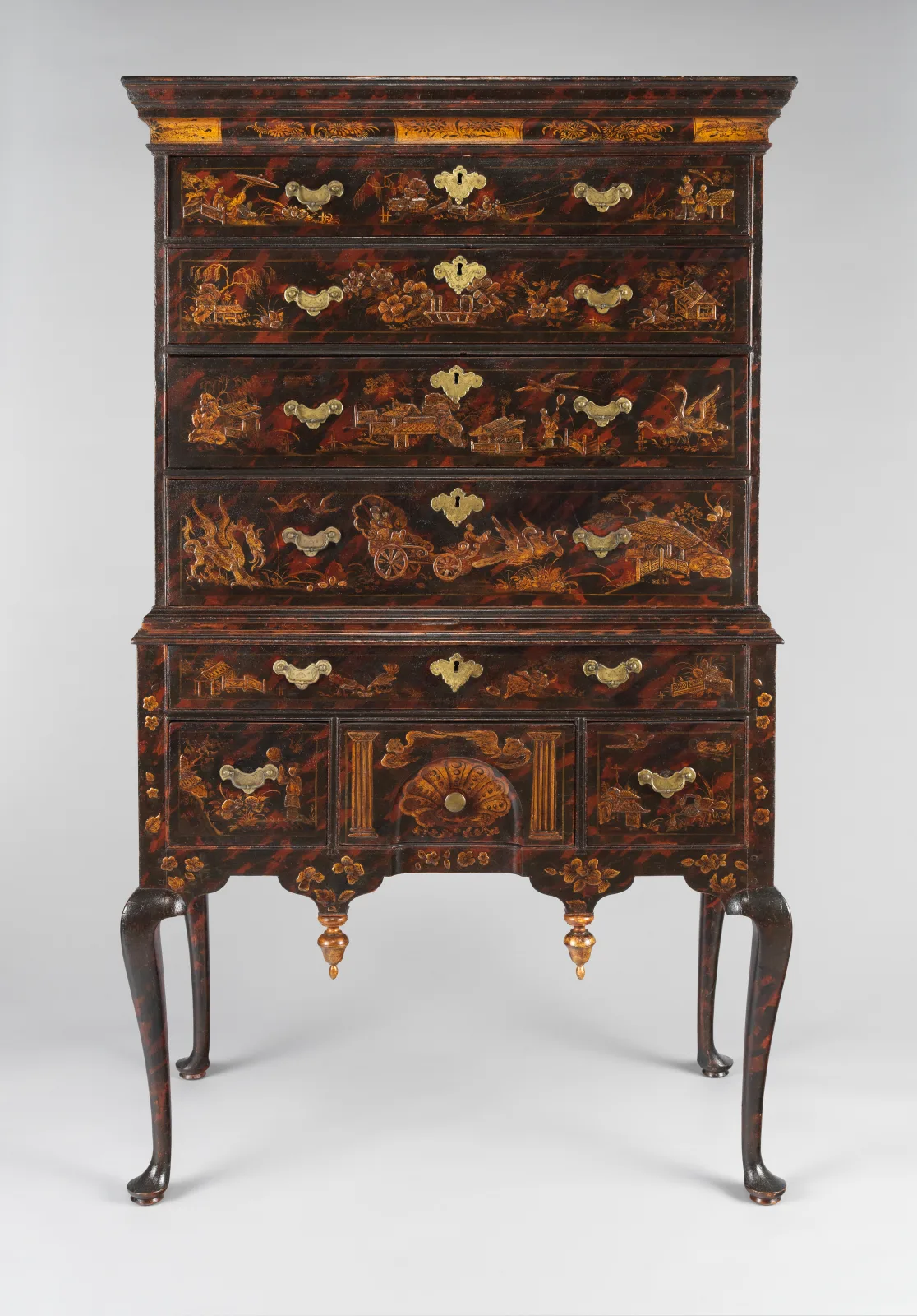 Boston high chest of drawers with a streaked red and black ground and gilt Chinese-style figures, birds and buildings on every drawer