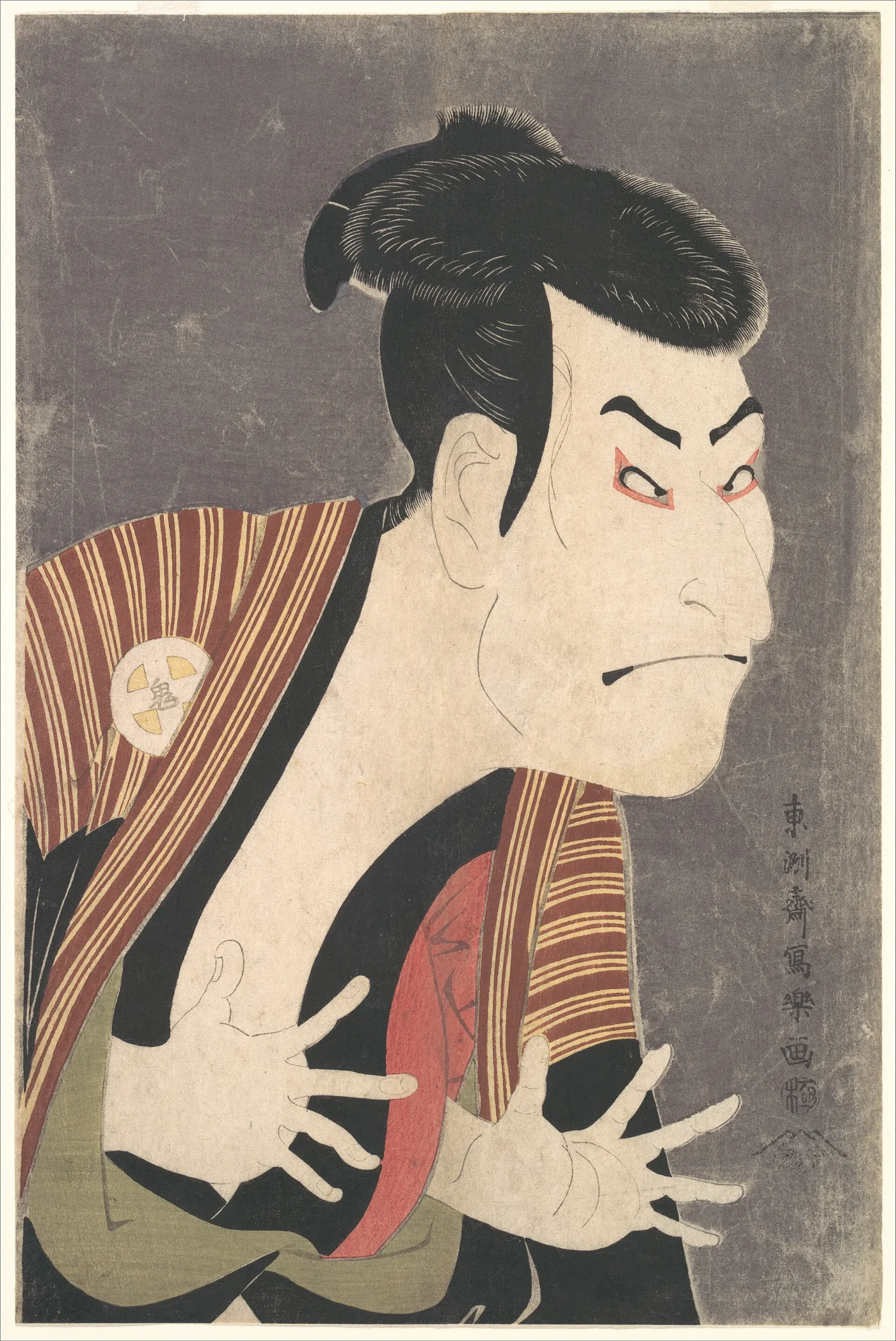 Kabuki actor in a striped robe with fingers spread and eyebrows drawn down, printed against a dark grey mica ground