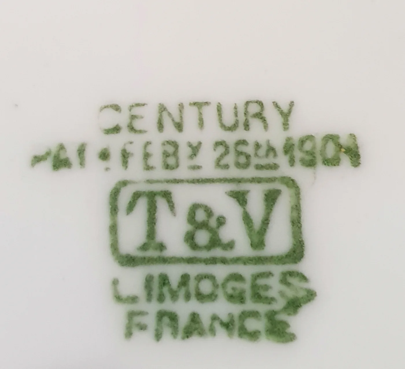 Green underglaze factory stamp on white porcelain reading T&V Limoges France with the date February 26th 1901