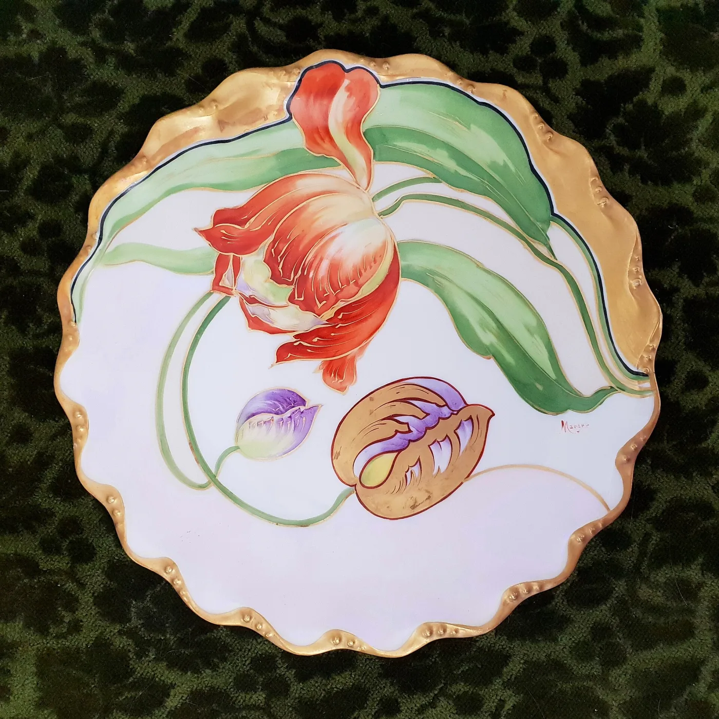 Porcelain cabinet plate hand-painted with pale art nouveau tulips and a wide gilded scalloped rim