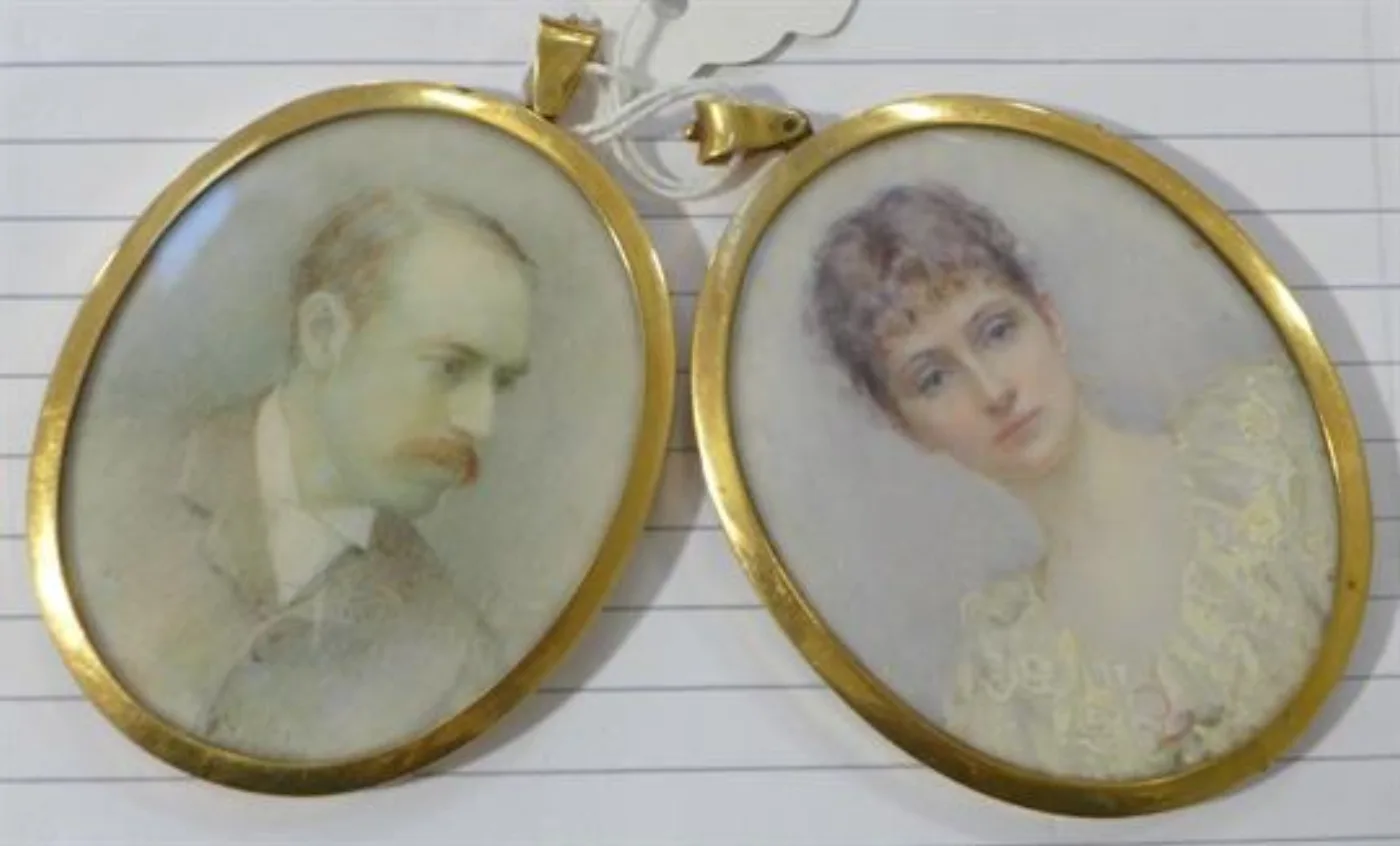 Pair of oval ivory portrait miniatures of a husband and wife in matching gold frames
