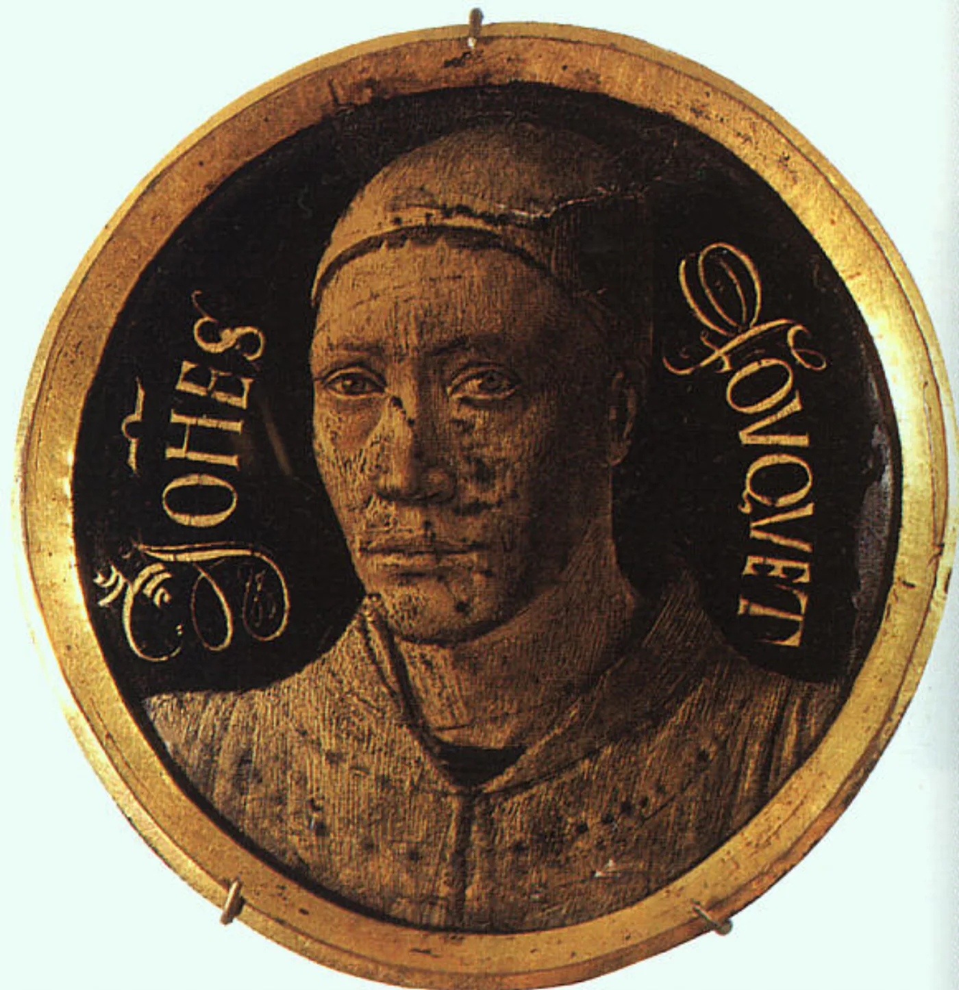 Circular enamel self-portrait of Jean Fouquet in gold on dark ground, framed as a roundel