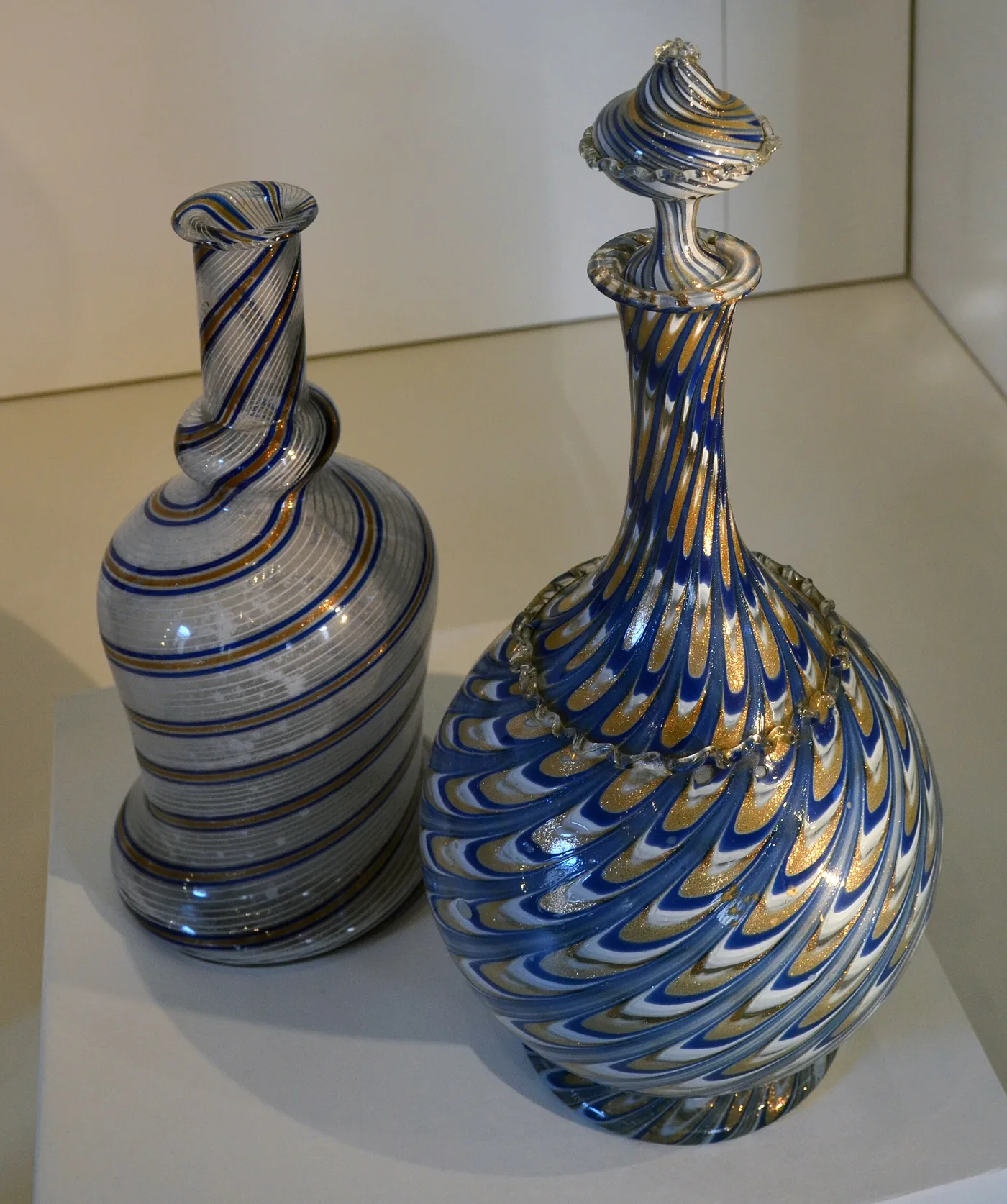 Two avventurina vessels with spiralling bands in which suspended copper particles catch the light