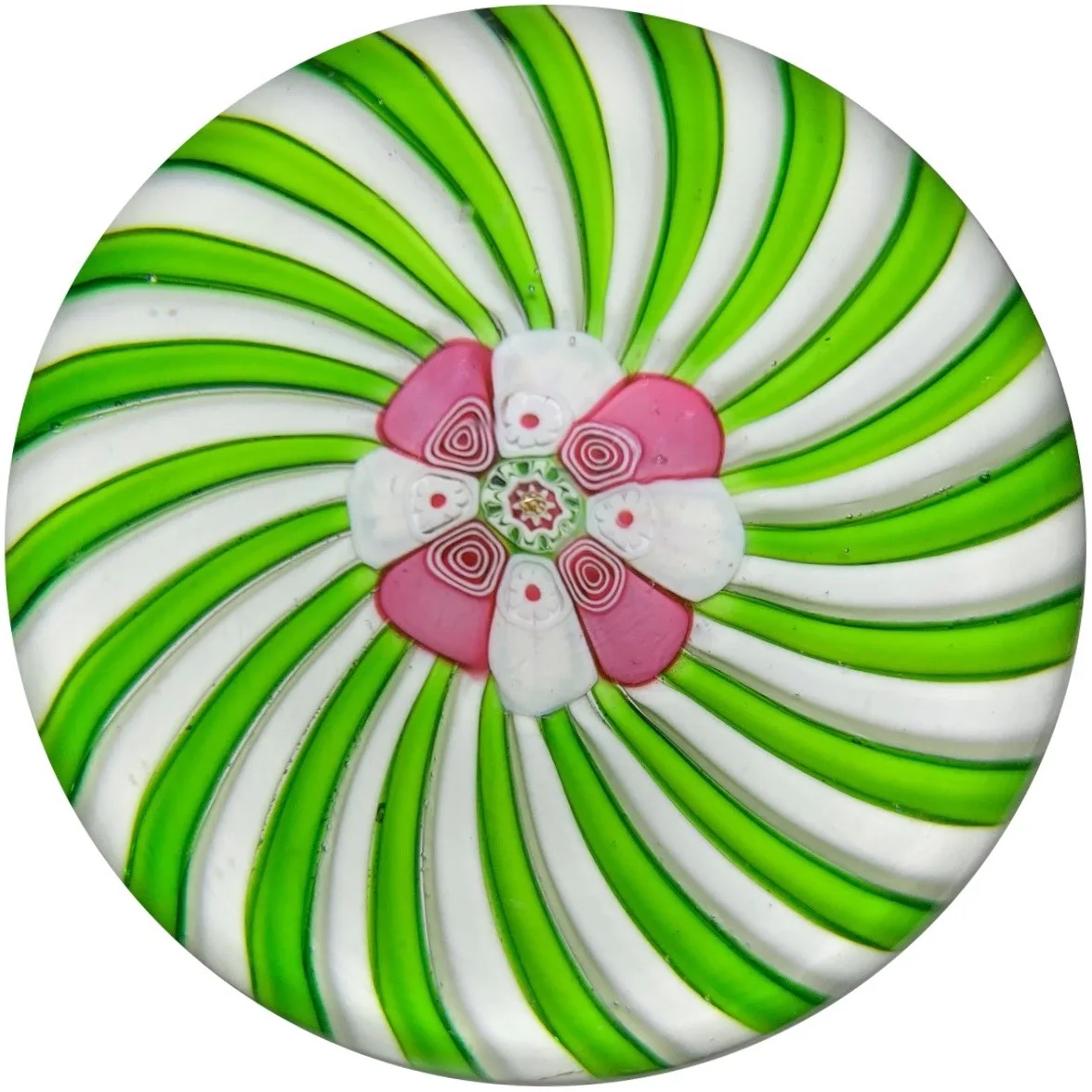 Paperweight with broad green and white spiral ribbons radiating from a central pink and white rose-shaped cane