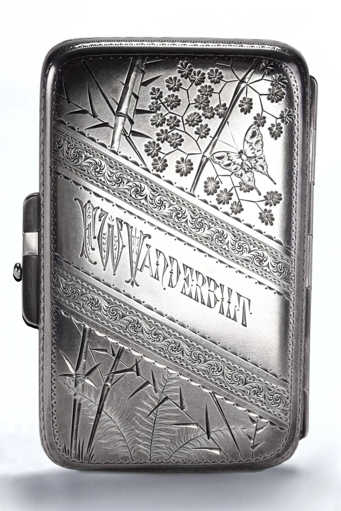 Silver cigarette case engraved with bamboo, blossom and a butterfly, crossed by a scrolled band engraved W K Vanderbilt