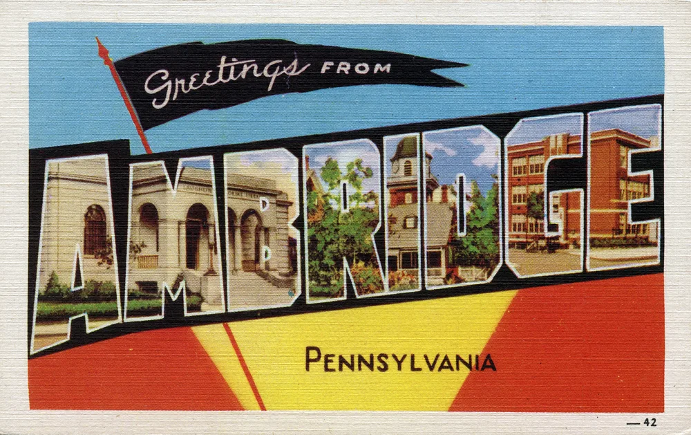 Brightly coloured linen-textured postcard reading Greetings from Ambridge, Pennsylvania, with photographs printed inside the outlined capital letters