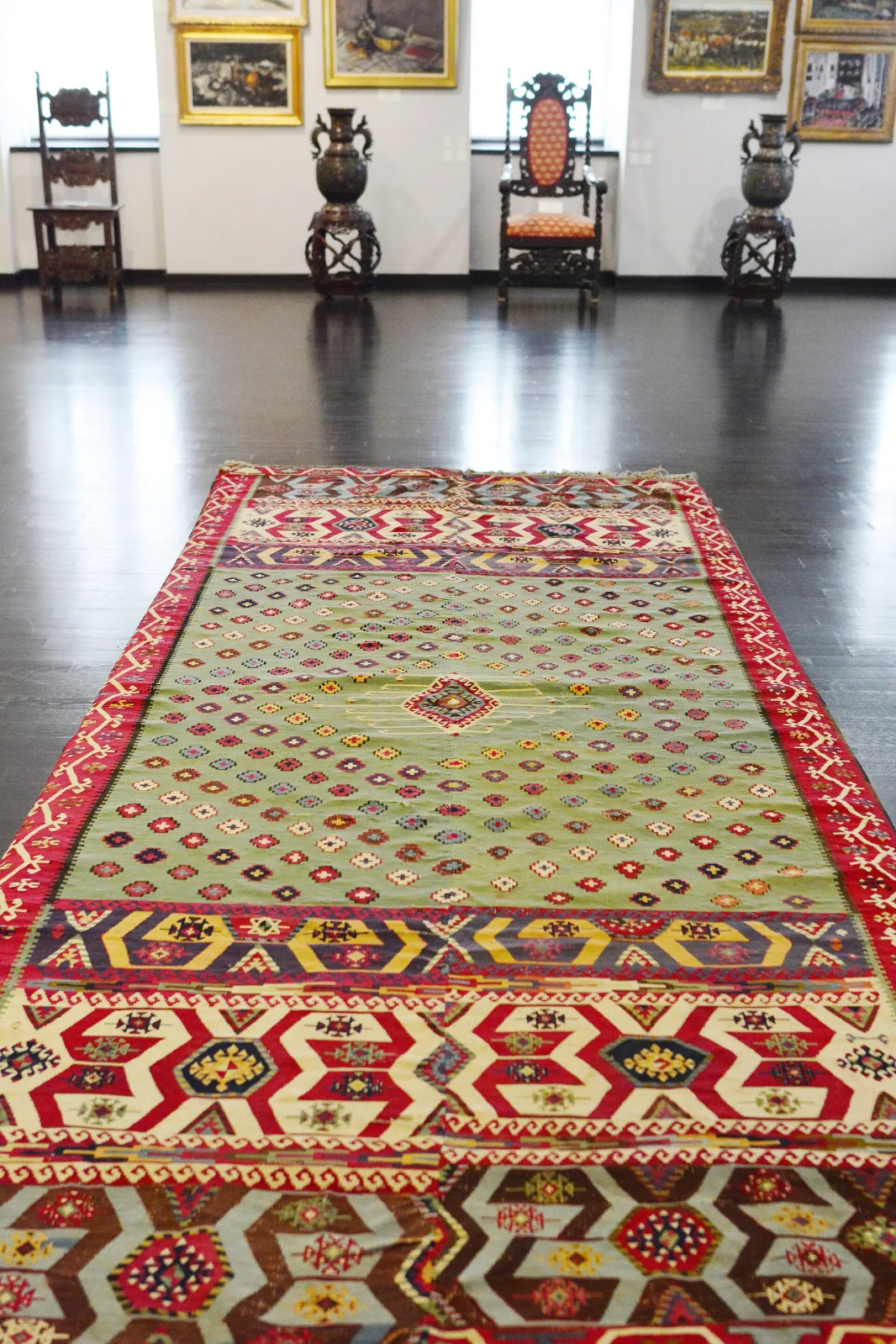 Reyhanli kilim from southeastern Anatolia, first half of the nineteenth century, woven in horizontal bands of diamonds, hooked forms and zigzags in red, white, blue and dark brown
