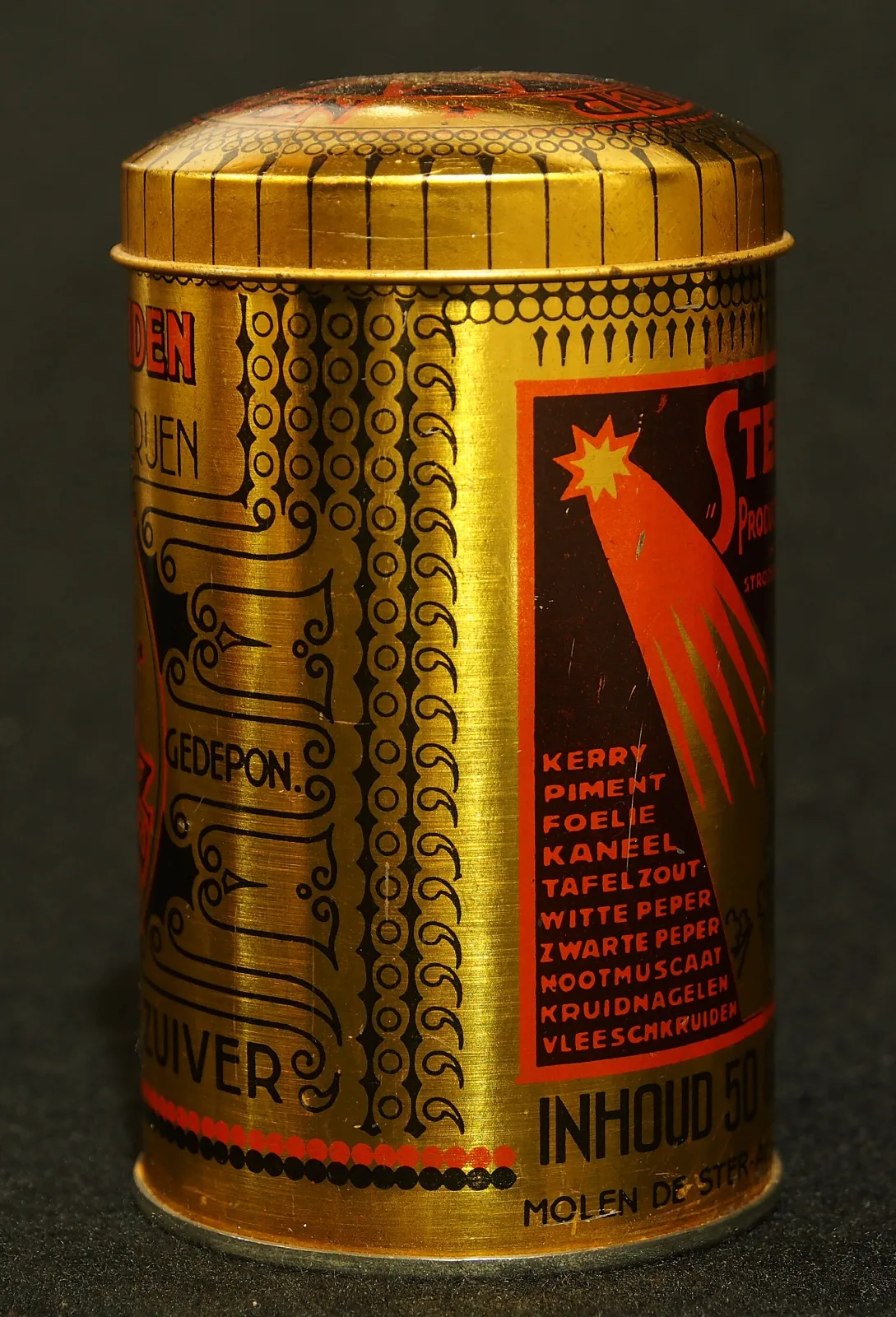 Gold lithographed cylindrical spice tin with a domed lid, a red shooting-star device and a printed list of spice names running down one panel
