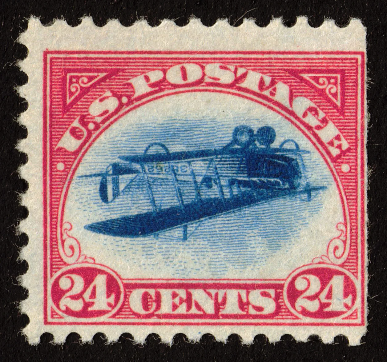 United States 24-cent airmail stamp with a carmine frame and a blue biplane printed upside down inside it
