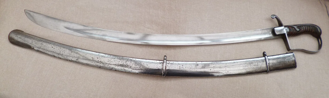 British 1796 pattern light cavalry officer's sabre showing its deeply curved blade and stirrup hilt