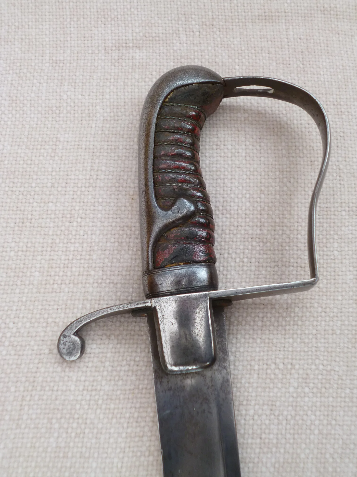 Stirrup hilt of a British 1796 pattern sabre with leather-covered grip and single knuckle bow