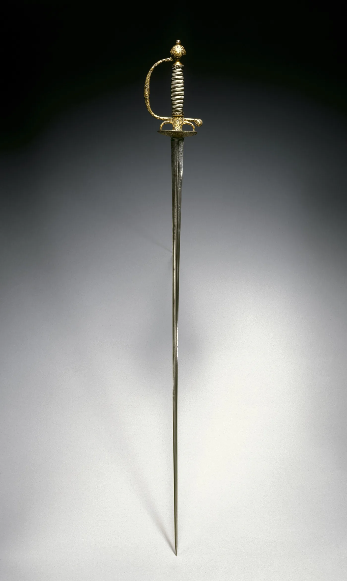 Gilt hilt of the same smallsword, showing the shell guard, knuckle bow and wire-bound grip