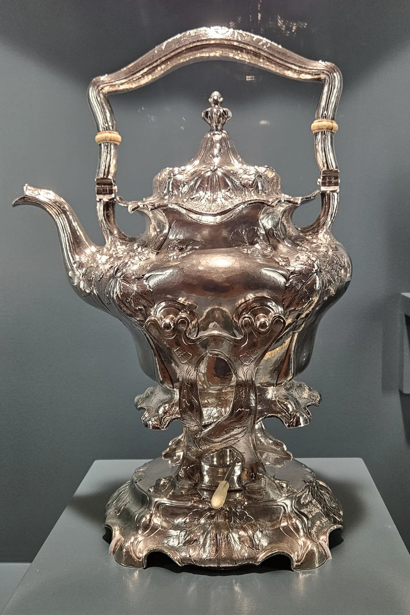 Gorham Martelé silver kettle on its stand with a spirit burner, decorated in repoussé poppies