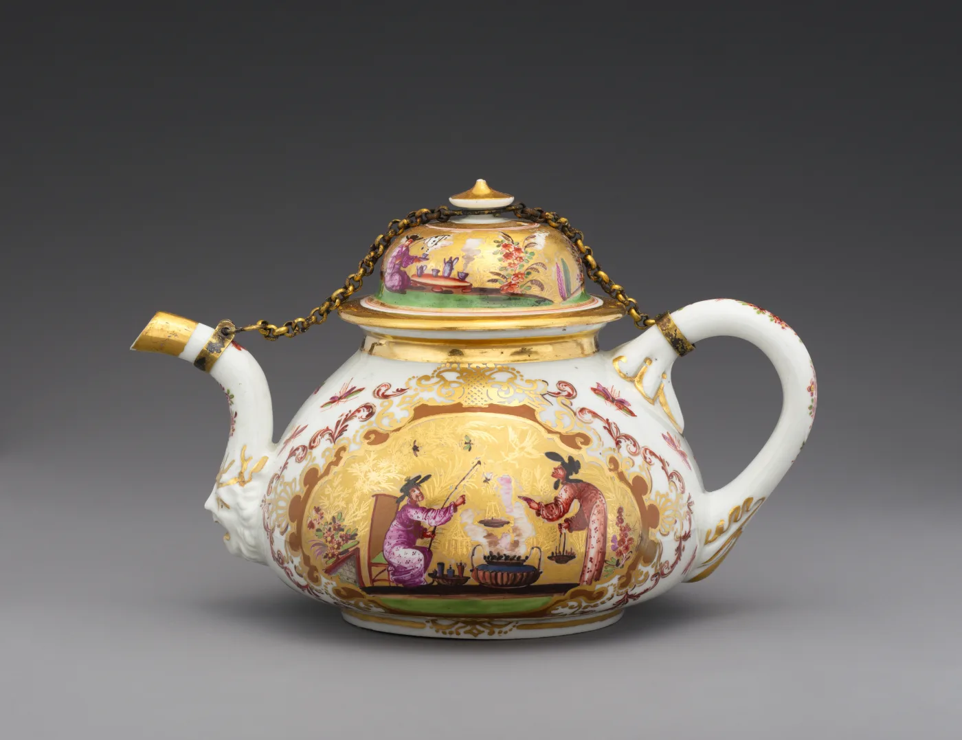 Meissen porcelain teapot of the 1720s with a yellow ground, chinoiserie panels and gilt mounts