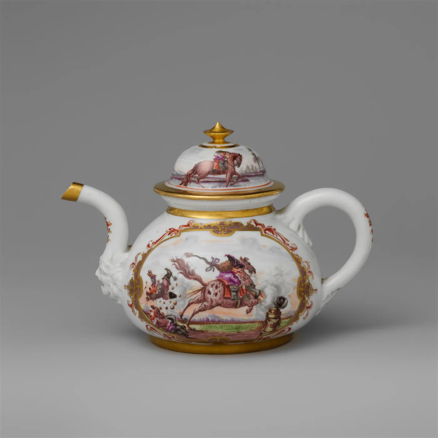 Early Meissen teapot painted with an equestrian scene in a gold-bordered reserve