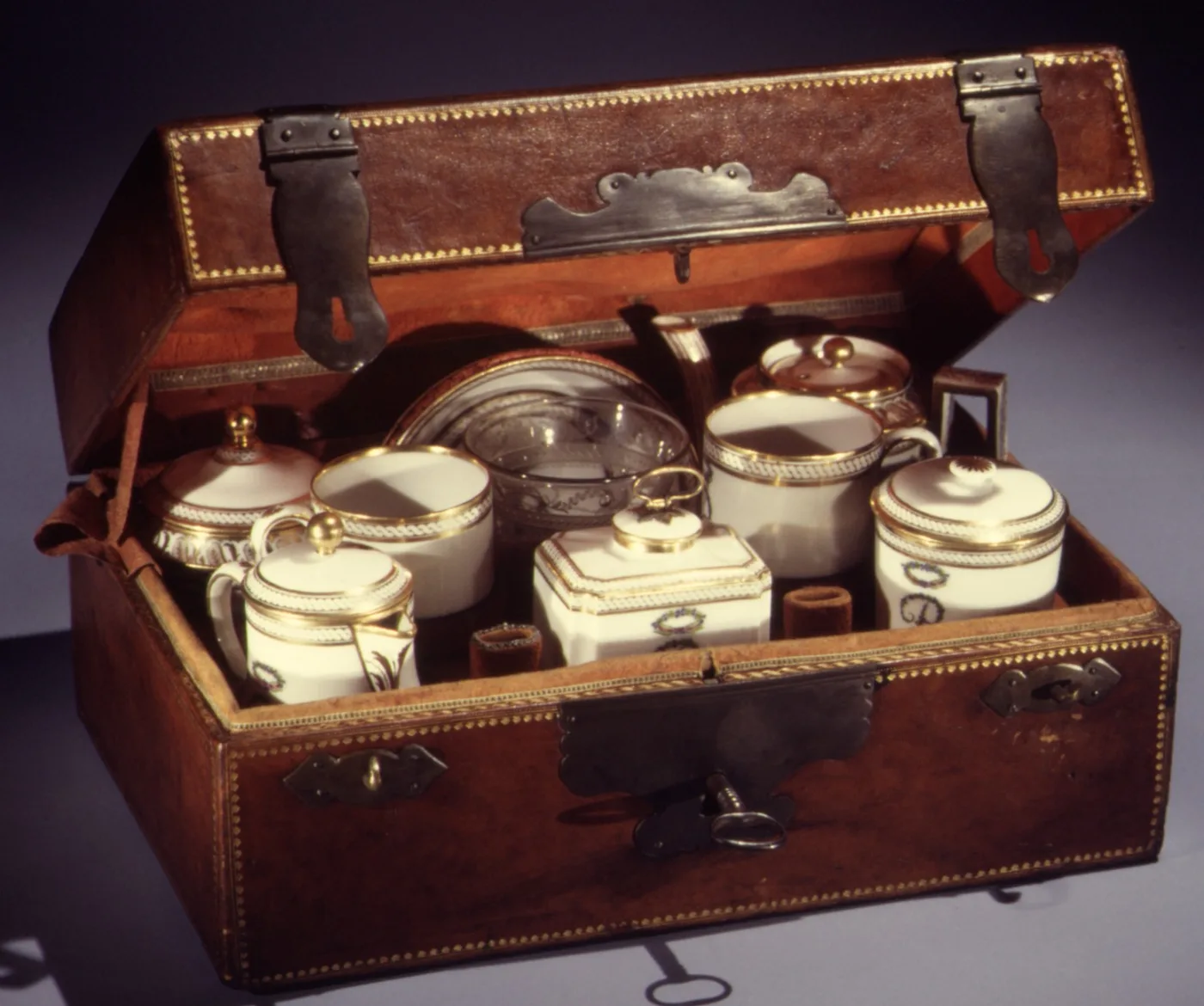 Porcelain travelling tea service packed into its fitted leather case with shaped compartments