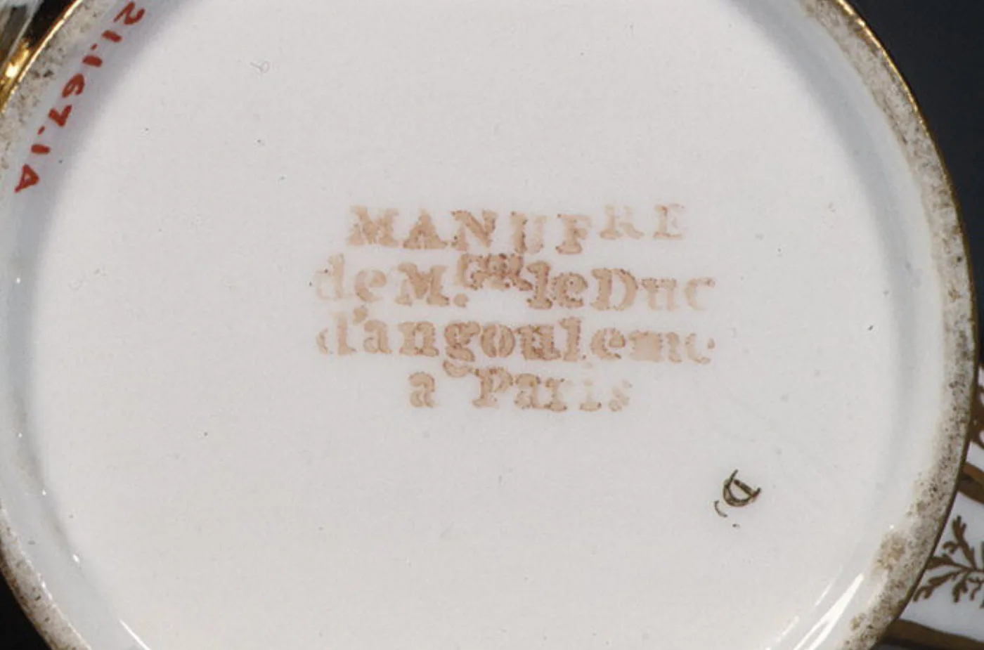 Underside of a piece from the service, painted in gold with the Duc d'Angoulême factory mark