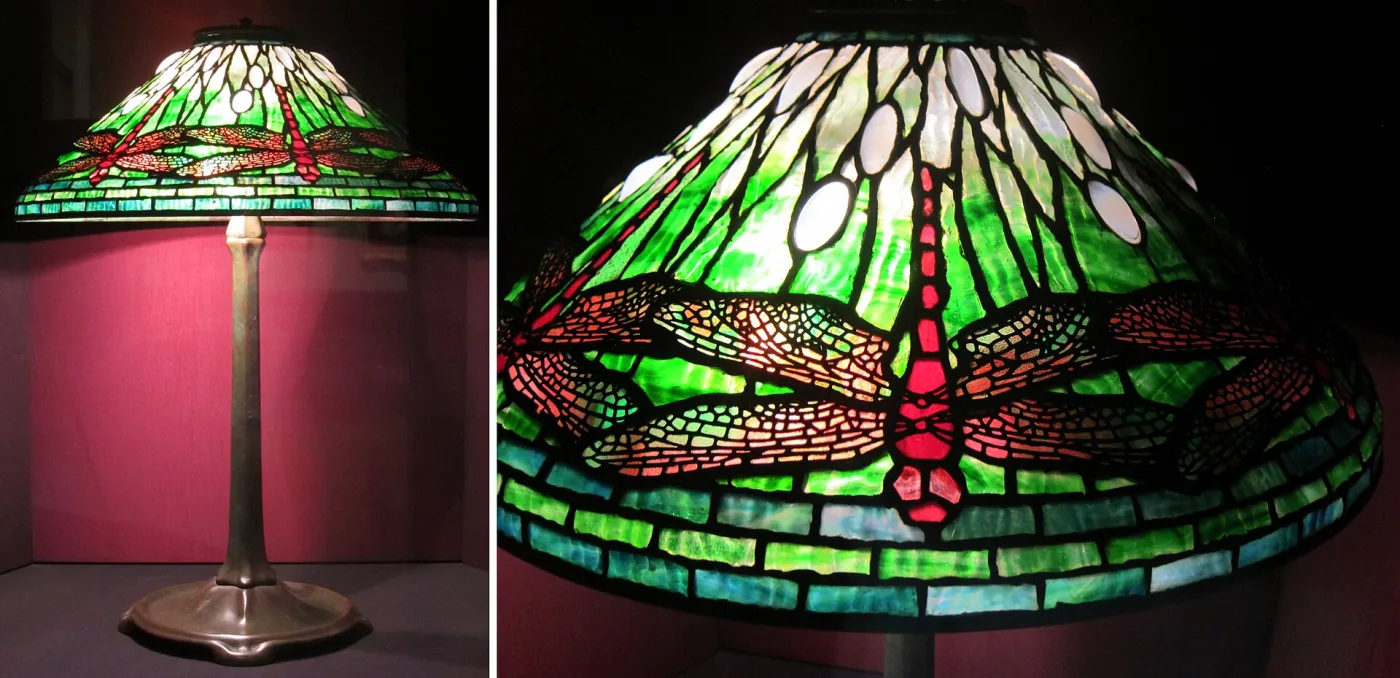 Two views of the same Tiffany dragonfly table lamp side by side, on the left the whole lamp lit against a pink wall, on the right the shade seen from above with seven dragonflies radiating across a green and white leaded ground