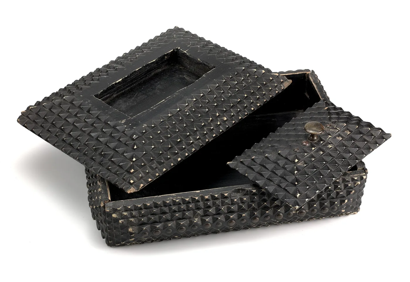 Black-painted tramp art box shown open, its pyramid-carved lid tilted back and an inner tray lifted out, revealing plain unpainted board inside