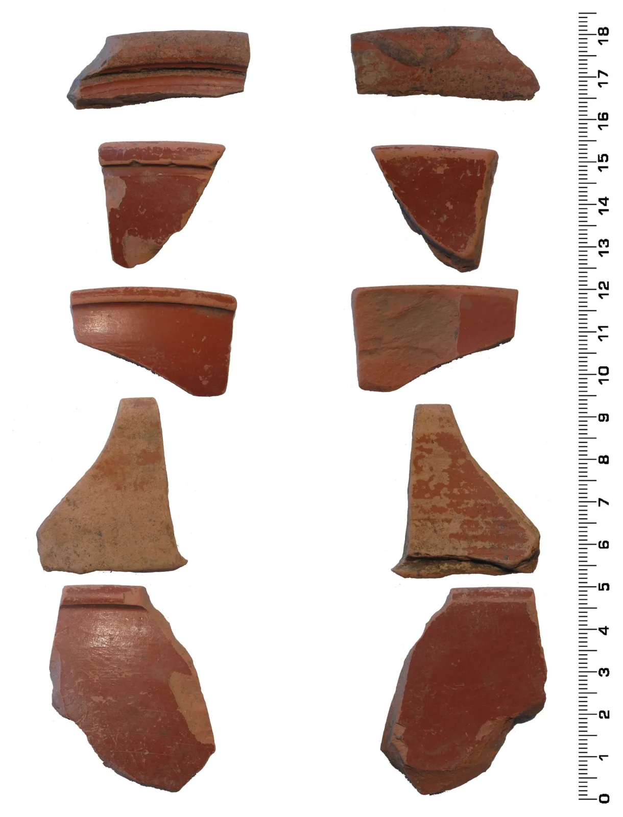 Ten red Roman pottery sherds arranged in two columns against a plain white ground beside a centimetre scale, each shown front and reverse