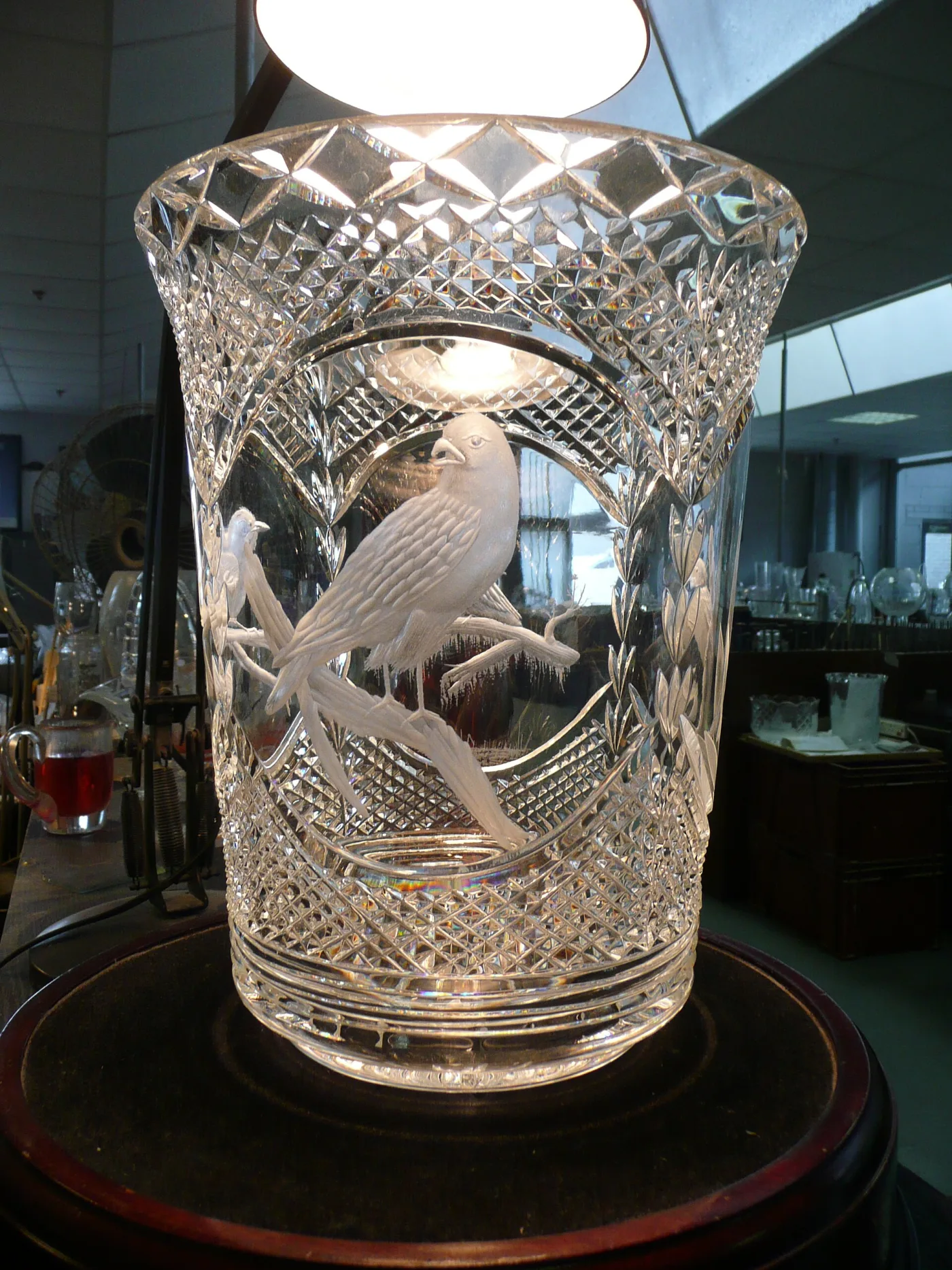Large flaring crystal vase deeply cut in diamonds, with two birds on a branch rendered in frosted copper-wheel engraving