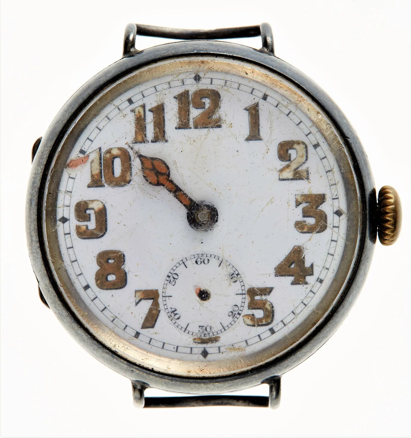 Silver-cased First World War wristwatch with a white enamel dial, bold gold Arabic numerals, wire lugs and a large onion crown