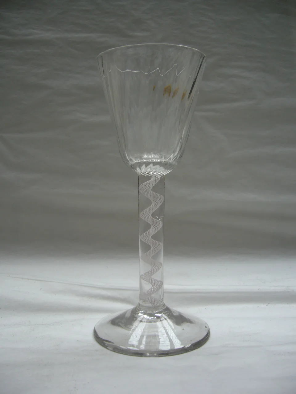 English air twist wine glass with a bucket bowl and an open single-series corkscrew of air running the length of the stem