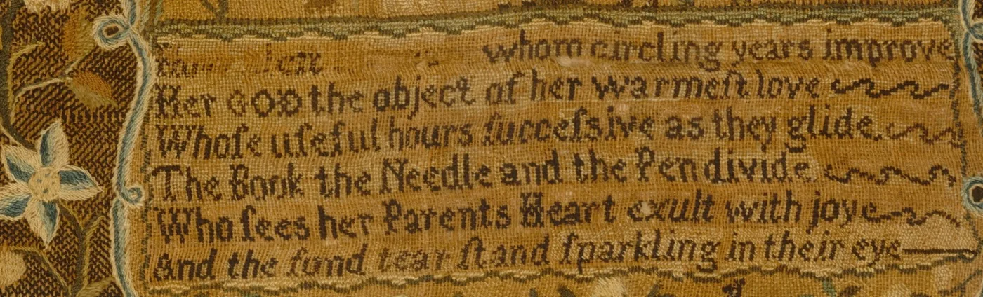 Close view of a worn silk verse panel in dark thread: whom circling years improve, Her God the object of her warmest love, The Book the Needle and the Pen divide