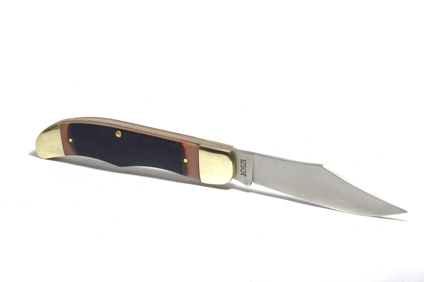 An Old Timer 125OT folding knife photographed on white, blade open, with black G-10 handle scales, brass bolsters and the model number 125OT marked on the blade