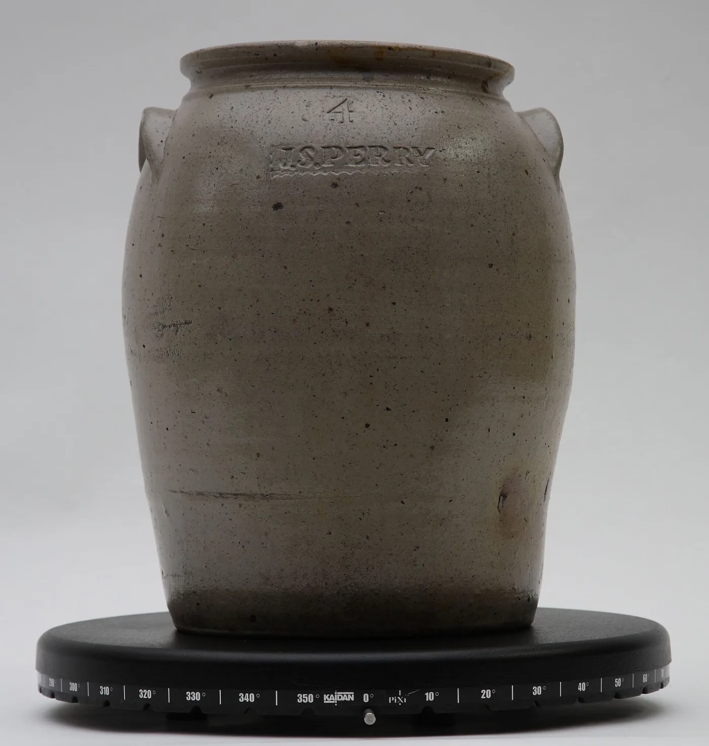 Pale grey salt-glazed stoneware jar of ovoid form with lug handles, an impressed numeral 4 near the rim and an impressed maker's die reading J S PERRY in a rectangular reserve