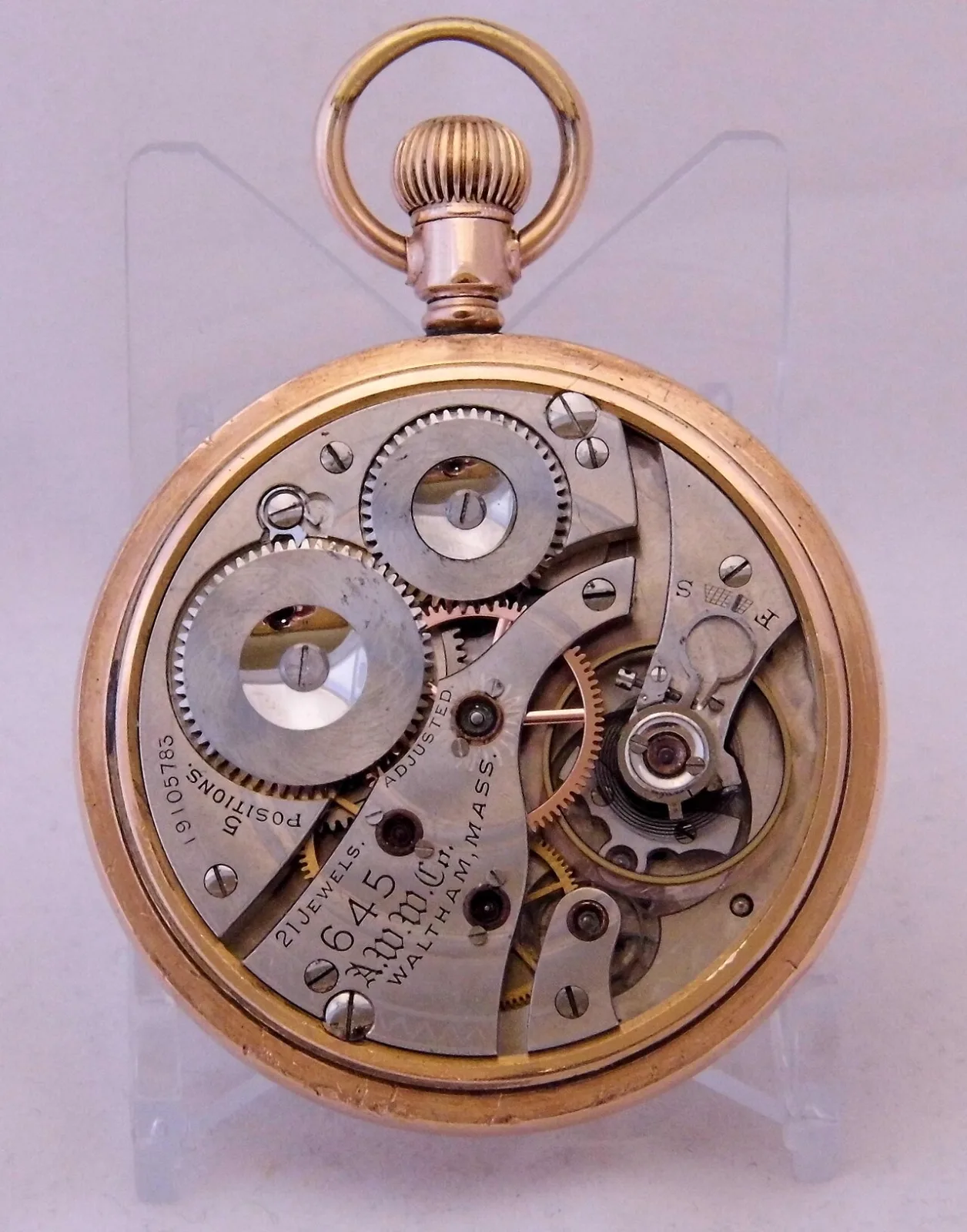 Nickel pocket watch movement engraved 645, A.W.W.Co., Waltham Mass., 21 Jewels, Adjusted, 5 Positions and the serial number 19105785