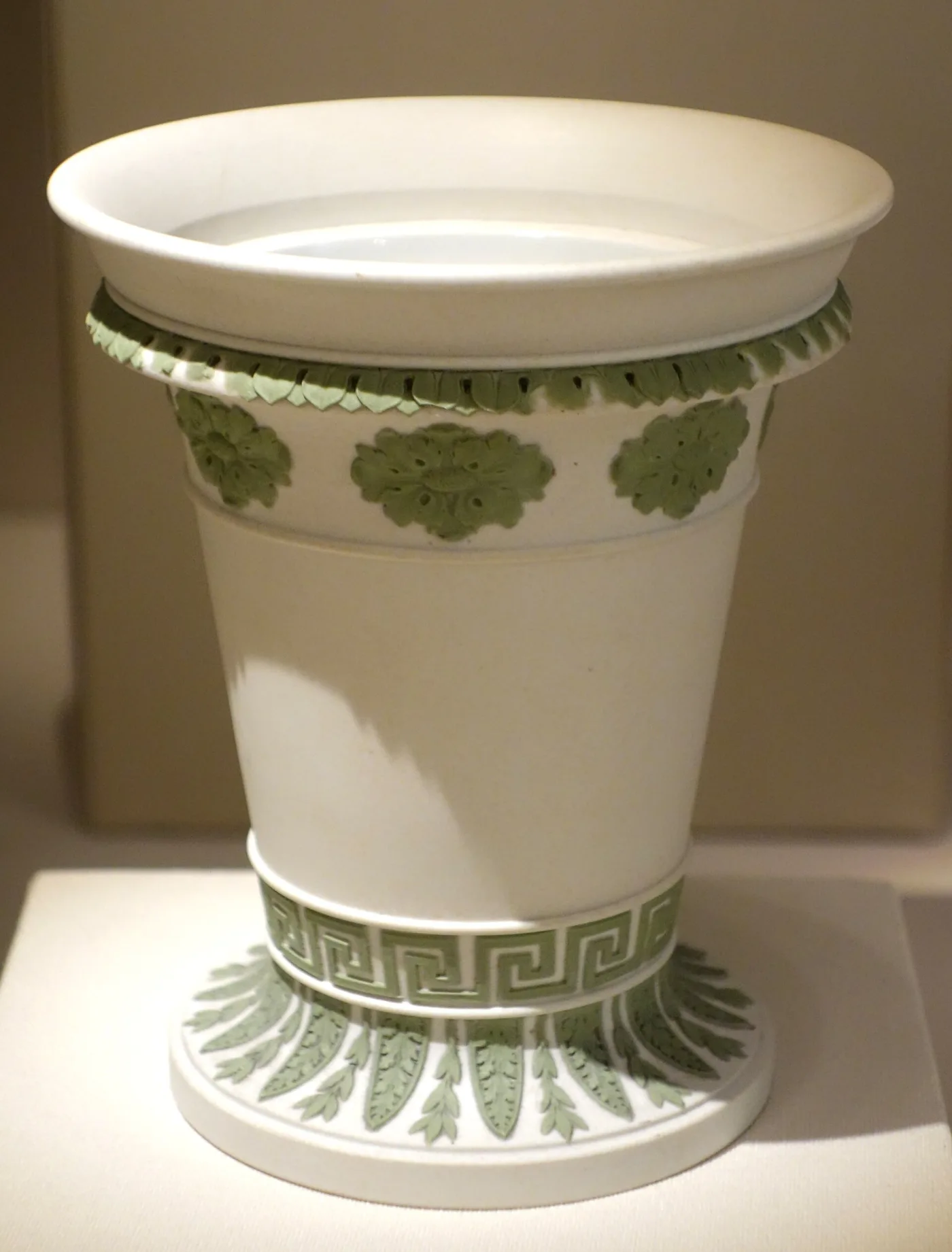 White Wedgwood jasper flower pot with sage green applied rosettes, Greek key band and leaf borders