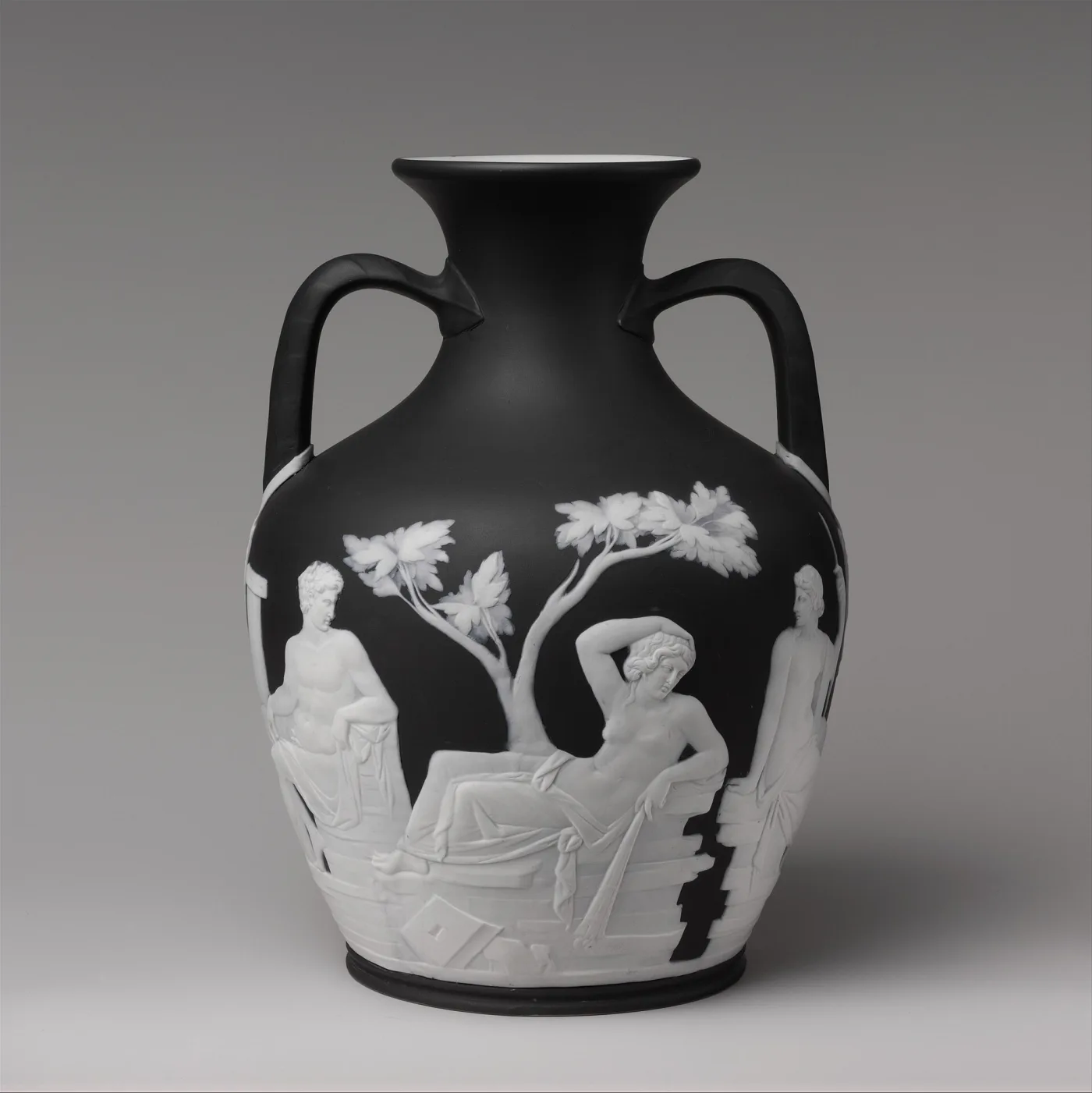 Wedgwood copy of the Portland Vase in black jasper with white classical figures, showing a white interior at the mouth